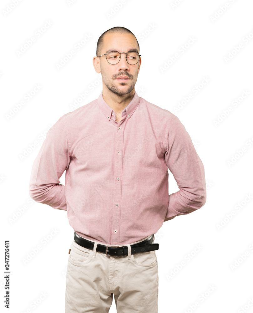 Fototapeta premium Hesitant young man looking up gesture