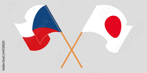 Crossed and waving flags of Czech Republic and Japan