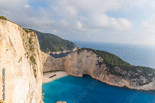Idyllic view of the beautiful Navagio beach on the island of Zakynthos in Greece. the cliffs are of white rock, the water of the sea a deep blue and the beach of white sand