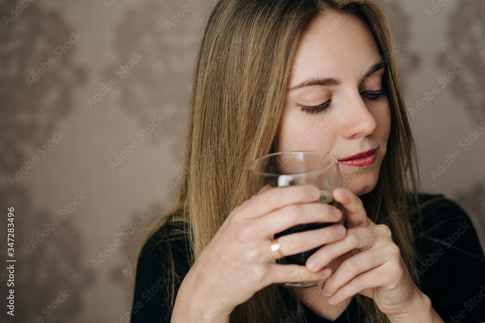Portrait of dreaming young blonde woman with cup of coffee Portrait of dreaming young blonde woman with cup of coffee