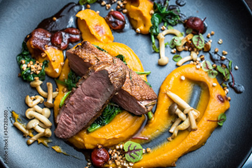 Grilled duck breast with vegetables, mushrooms