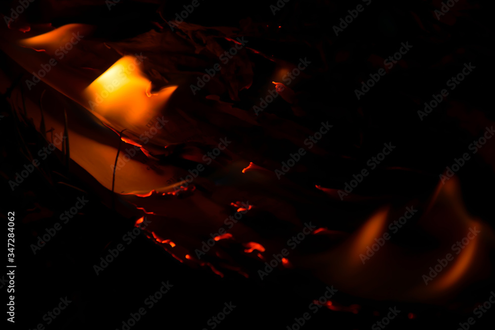 Fototapeta premium close up of a burning paper