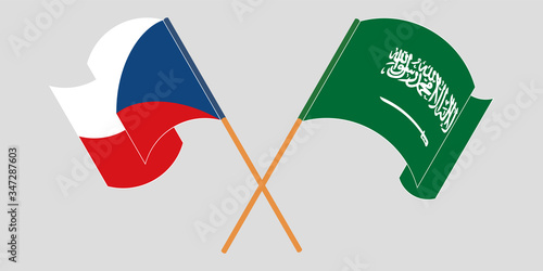 Crossed and waving flags of Czech Republic and the Kingdom of Saudi Arabia