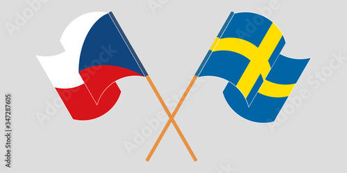 Crossed and waving flags of Czech Republic and Sweden