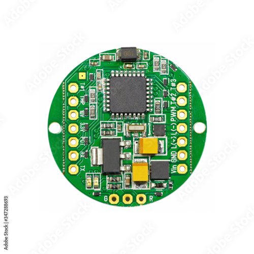 Obraz na płótnie Green round led pulse width modulation dimmer PCB board surface mount components in a close-up top view