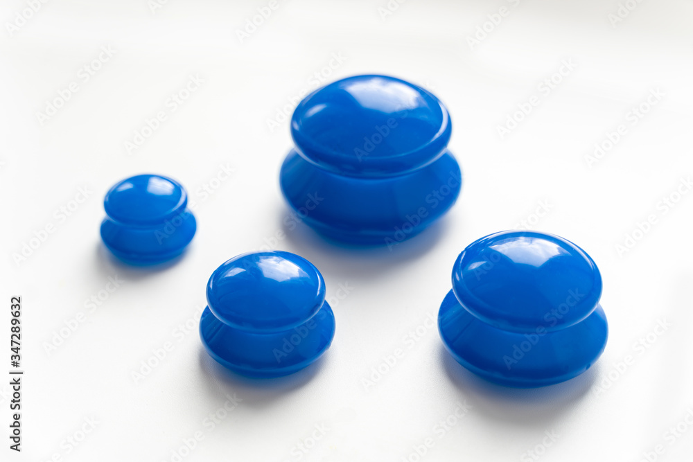 Silicone vacuum jars, banks for massage, anticellulite, face fitness, blue, on a white background Silicone vacuum jars, banks for massage, anticellulite, face fitness, blue, on a white background