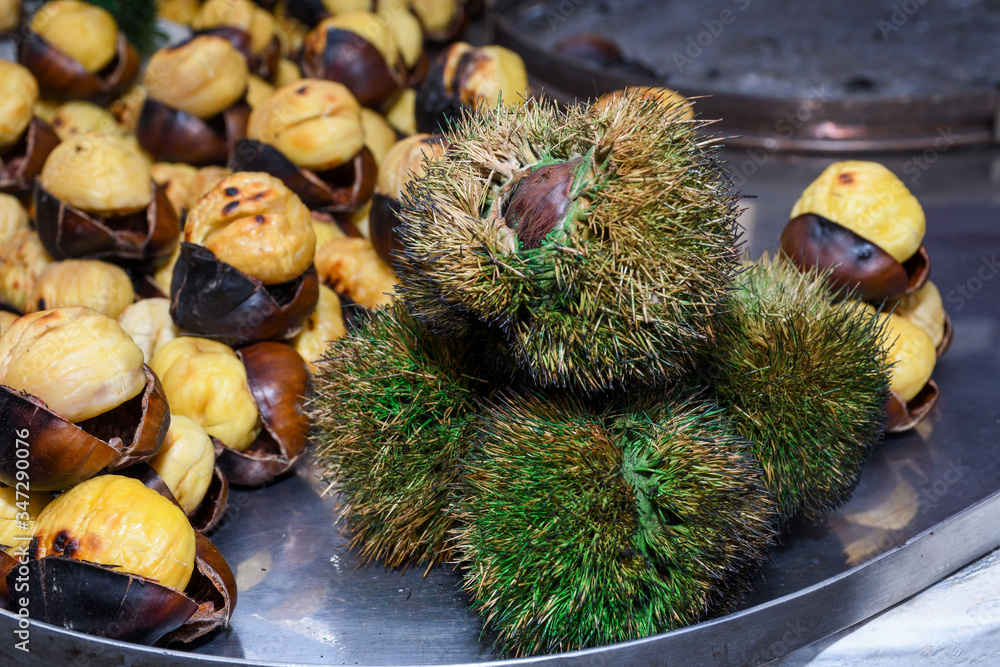 Roasting chestnuts on a street stall in Istanbul, Turkey. Selective focus. Roasting chestnuts on a street stall in Istanbul, Turkey. Selective focus.