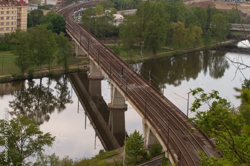  railway bridge in Prague over the Vltava river in the spring of 2020 in the Czech Republic. reflections can be seen on the surface