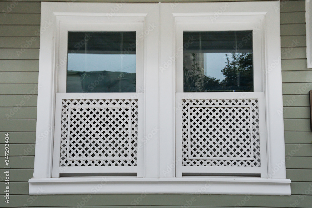 Fototapeta premium Beautiful decorated white and green window