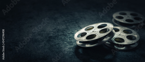 Fotografie, Tablou 3D rendering of movie reels on a dark blue surface