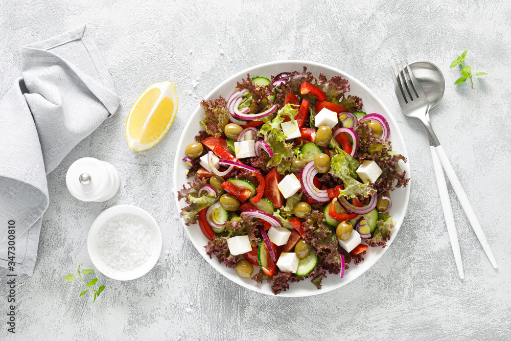 Greek salad with fresh vegetables, lettuce and feta cheese Greek salad with fresh vegetables, lettuce and feta cheese