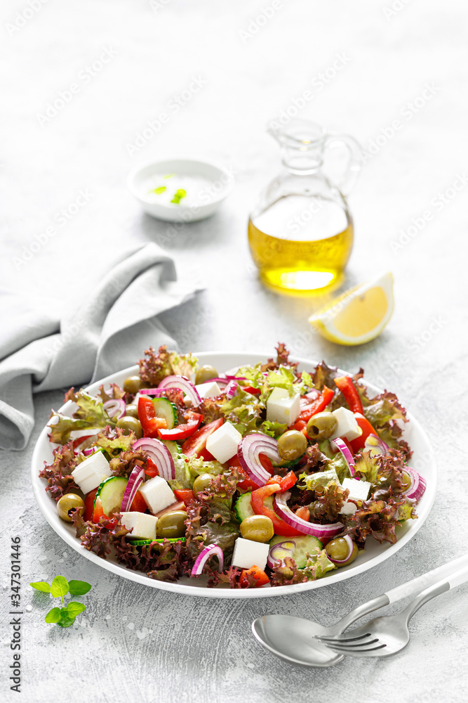 Greek salad with fresh vegetables, lettuce and feta cheese Greek salad with fresh vegetables, lettuce and feta cheese
