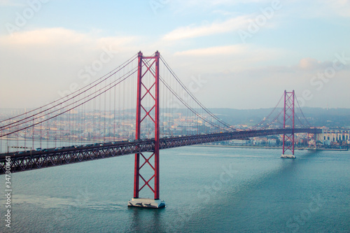 View of 25th of April Bridge, a suspension bridge connecting the city of Lisbon, capital of Portugal, to the municipality of Almada on the left (south) bank of the Tagus river. Lisbon, Portugal