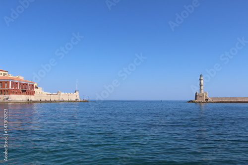 Fototapeta Naklejka Na Ścianę i Meble -  Lighthouse in the old Venetian Harbor of Chania, in Crete Island, Greece.