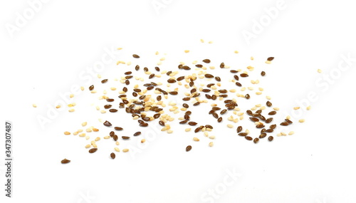 Organic Linseed or Flaxseed (Linum usitatissimum) and sesame isolated on white background.