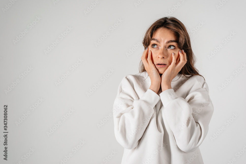 Portrait of a smiling thinking woman looking up - isolated on white Portrait of a smiling thinking woman looking up - isolated on white