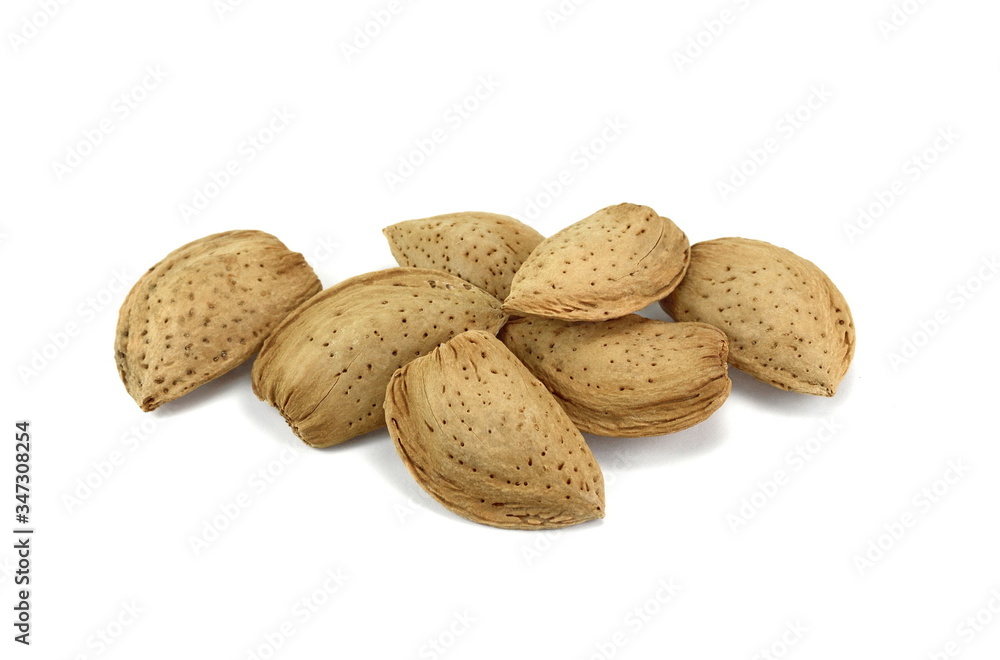 Unshelled almonds isolated on white background. Almond nut in shell. Unshelled almonds isolated on white background. Almond nut in shell.