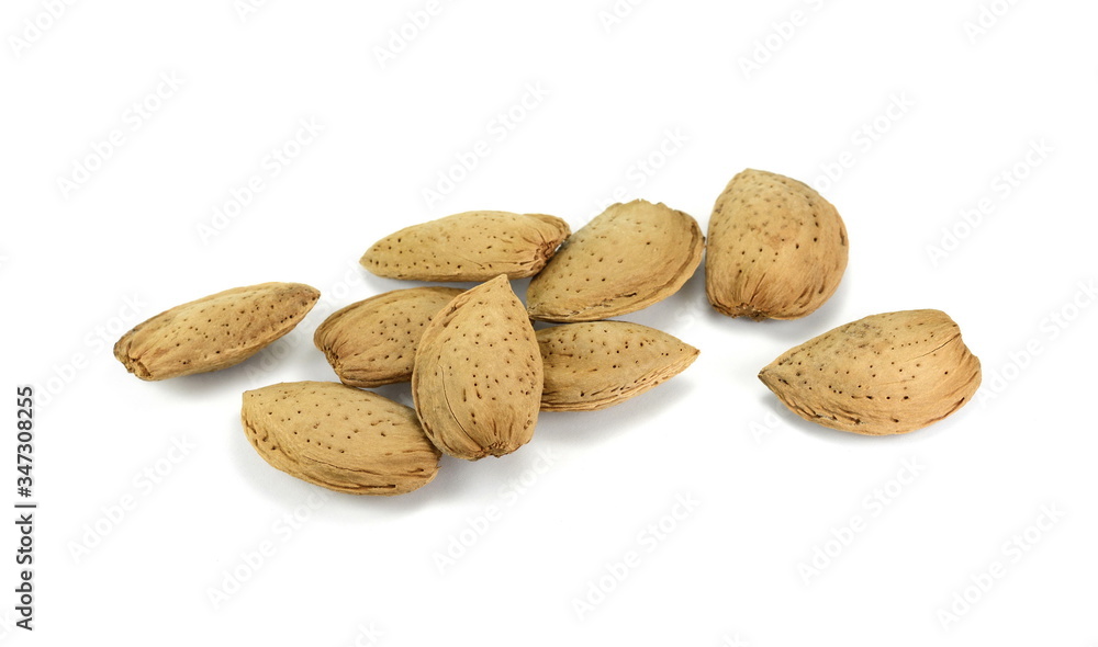Unshelled almonds isolated on white background. Almond nut in shell. Unshelled almonds isolated on white background. Almond nut in shell.
