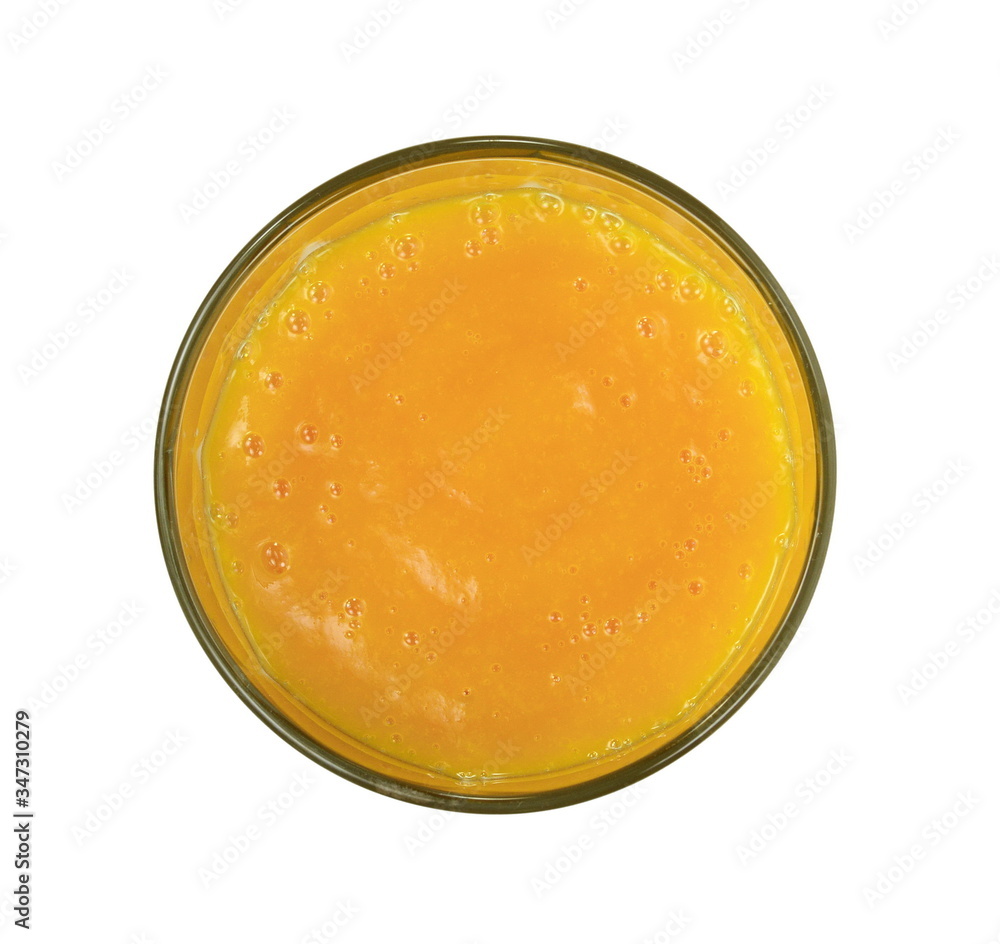 Glass of milkshake or cocktail isolated on white background. Mango, grapefruit, tangerine mix. Top view Glass of milkshake or cocktail isolated on white background. Mango, grapefruit, tangerine mix. Top view