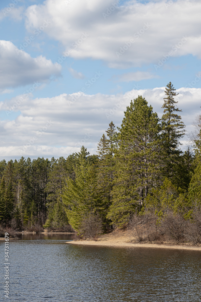 Blues and greens on a beautiful lake in northern Ontario near Algonquin Park in springtime 