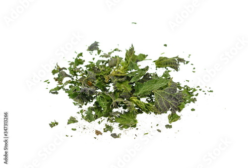 Closeup of dried nettle, heap of dried nettle isolated. Dry cut nettle pile, isolated on white background.