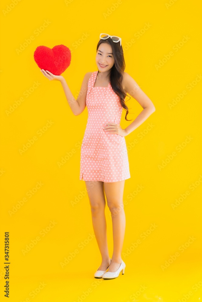 Portrait beautiful young asian woman with heart pillow Portrait beautiful young asian woman with heart pillow