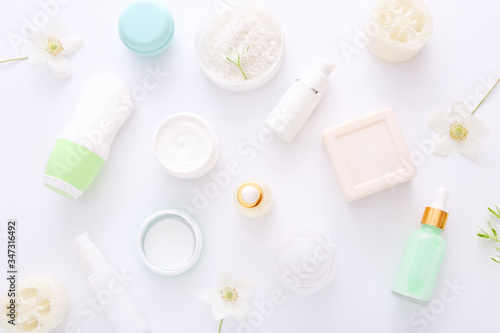 Top view of cosmetic products with natural ingredients on white background for natural beauty. Beauty spa background