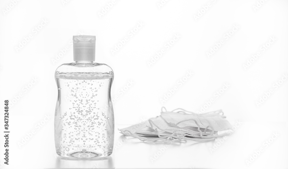 Sanitizer and mask isolated on white Sanitizer and mask isolated on white