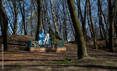 
Religious sculpture showing the figure of Mary holding Jesus after being removed from the cross in the park.