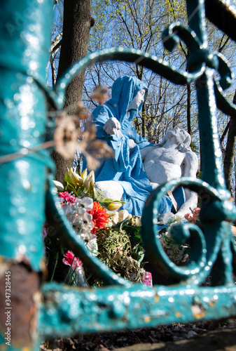 
Religious sculpture showing the figure of Mary holding Jesus after being removed from the cross in the park.