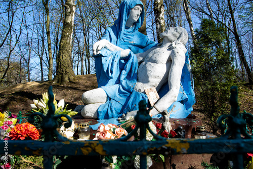 
Religious sculpture showing the figure of Mary holding Jesus after being removed from the cross in the park.