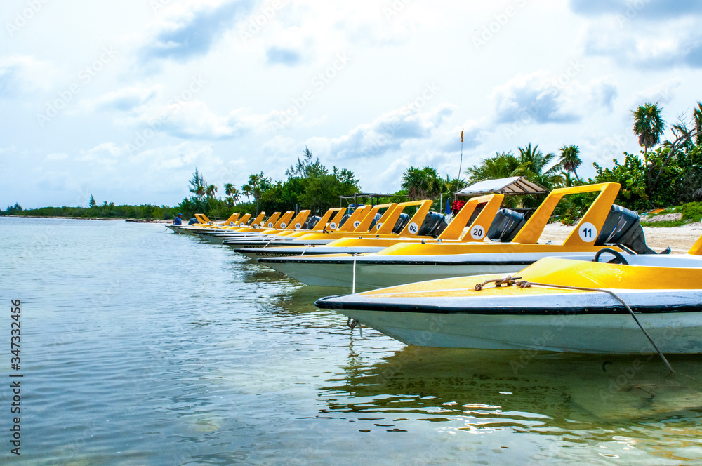 Fototapeta premium Line-up of high speed boats in water.