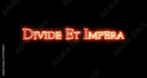 Divide et Impera written with fire. Loop photo