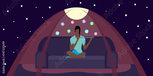 Enchantress woman sits in pose lotus on sofa in magic tent under night starry sky. Flute playing. Beautiful african american in bright dress. Magic  flying flowers. Vector flat illustration.