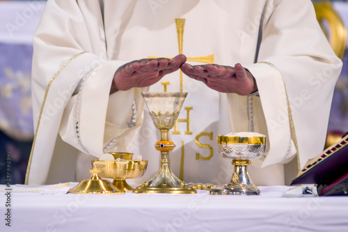 chalice with wine, blood of christ, and pyx with bread, body of christ, ready for the communion of the faithful