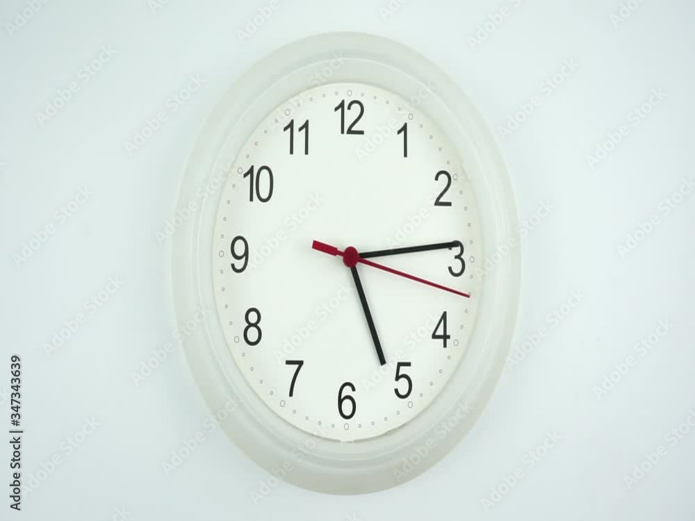 White wall clock isolated on white background, face beginning of time 05.14 am or pm, Clock minute walk slowly, Time concept. White wall clock isolated on white background, face beginning of time 05.14 am or pm, Clock minute walk slowly, Time concept.