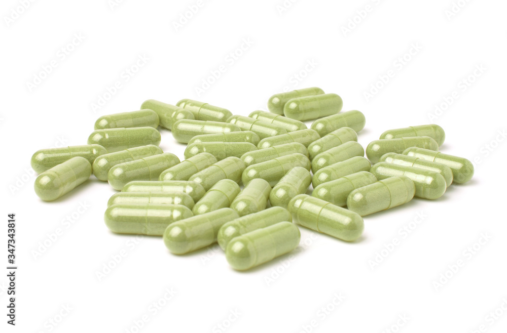 Herbal capsules, andrographis Paniculata capsules isolated on a white background. Herbal capsules, andrographis Paniculata capsules isolated on a white background.