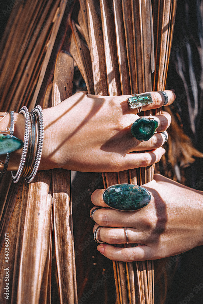 close up of woman hands with with gem stones accessories outdoors Stock Adobe Stock
