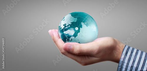 Globe  earth in  hand  holding our planet glowing. Earth image provided by Nasa