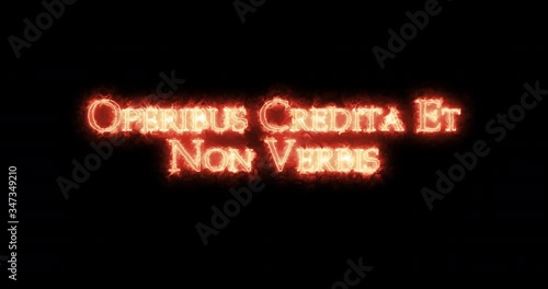 Operibus credita et non verbis written with fire. Loop photo