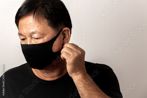 Close-up face of a Asian man wearing a mask