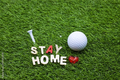 Golf Stay home during covid 19 with golf ball and tee on green grass