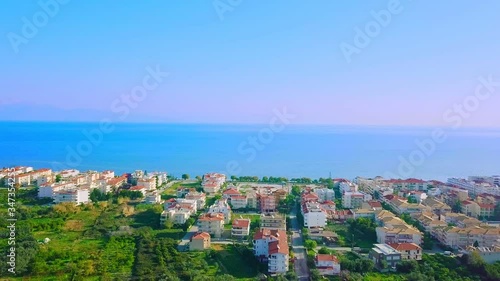 Aerial view of Gulf of Corinth in Greece and towns on the shore at dusk, coastal cityscape by Ionian Sea photo