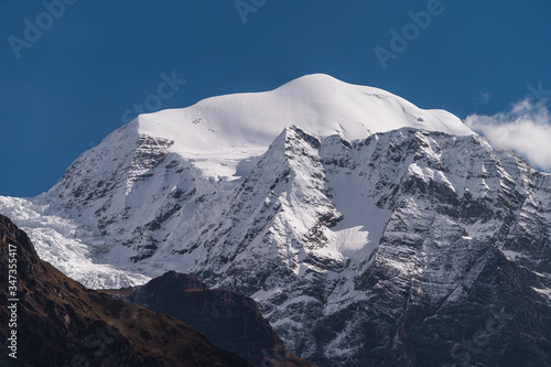 Saula mountain peak view from Lho village in Manaslu circuit trekking route, Himalaya mountains range in Nepal