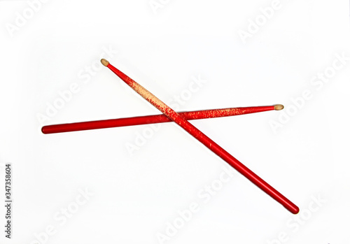 red drumsticks isolated on white background flat lay