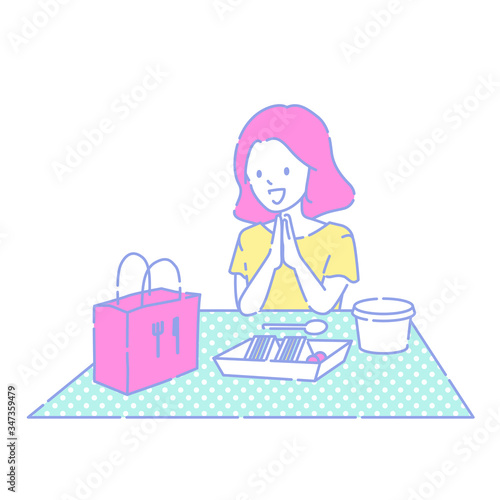 テイクアウトで食事をする女性
