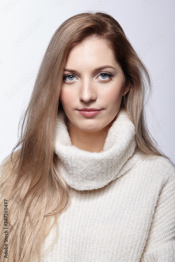 Naklejka premium Blonde woman in woolen sweater