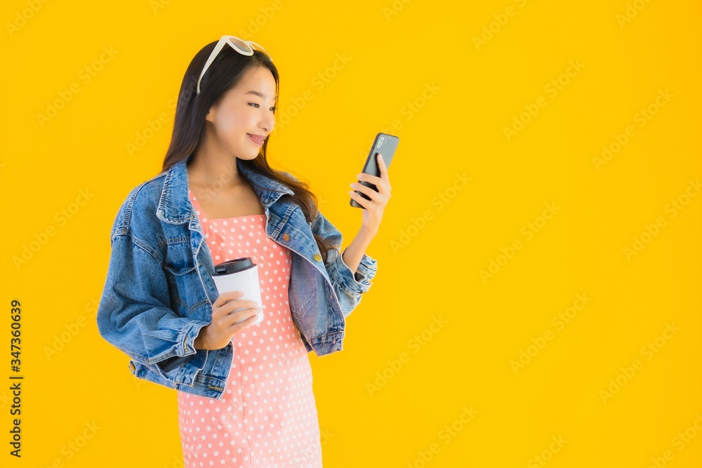 Portrait beautiful young asian woman with coffee cup and smart mobile phone Portrait beautiful young asian woman with coffee cup and smart mobile phone