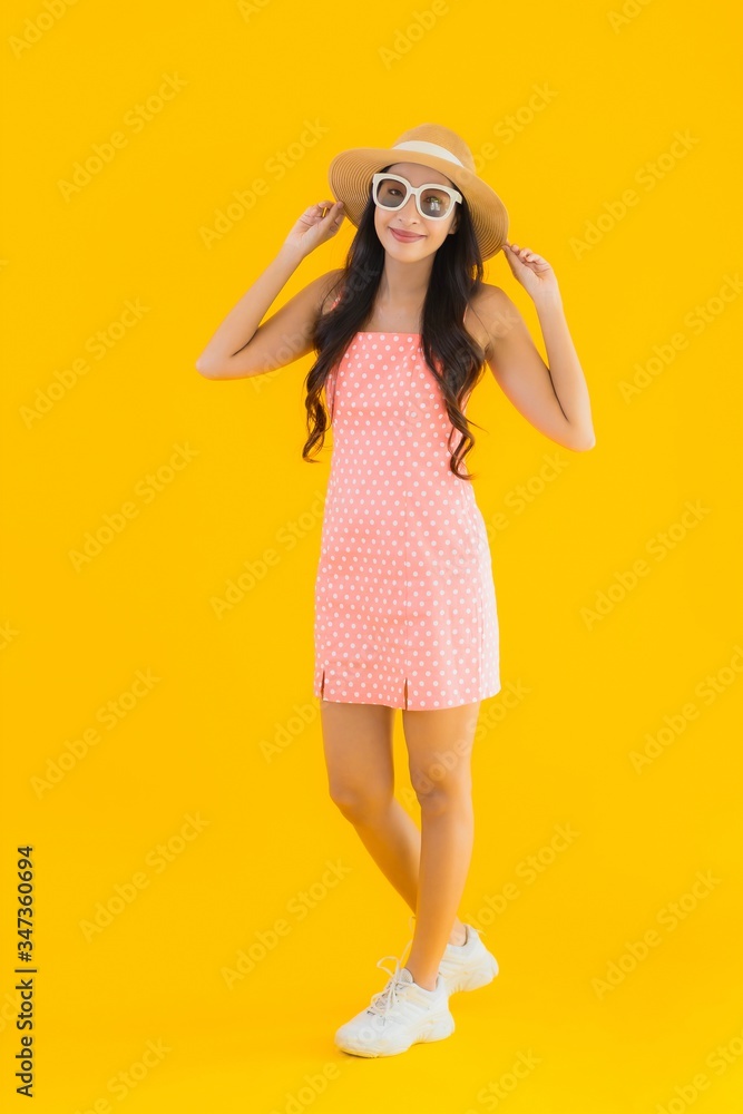 Portrait beautiful young asian woman smile happy relax on yellow isolated Portrait beautiful young asian woman smile happy relax on yellow isolated