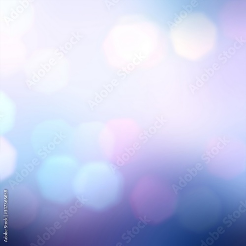 Bokeh on blurred blue lilac night sky background. Delicate lights pattern.